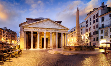  The Pantheon in Rome, Italy at dawn with a bustling street cafe and city lights